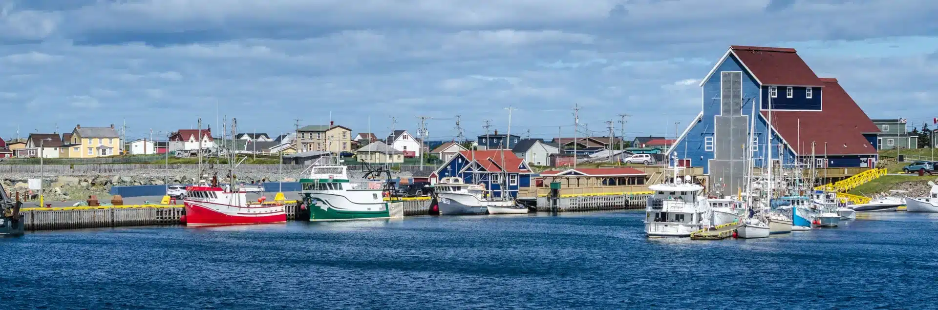 Moving from Ontario to Newfoundland and Labrador and looking at boat docked in the water.