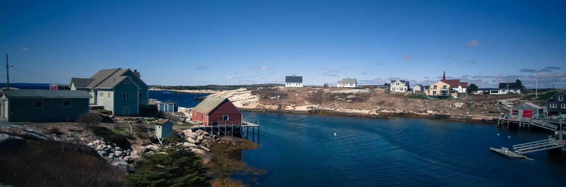 A view of a small fishing village on a rocky shore while moving to Nova Scotia.