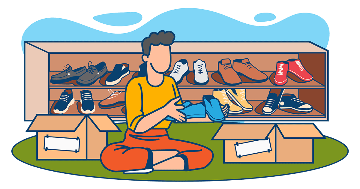 Individual organizing shoes beside boxes and a shoe rack while preparing to pack for a move